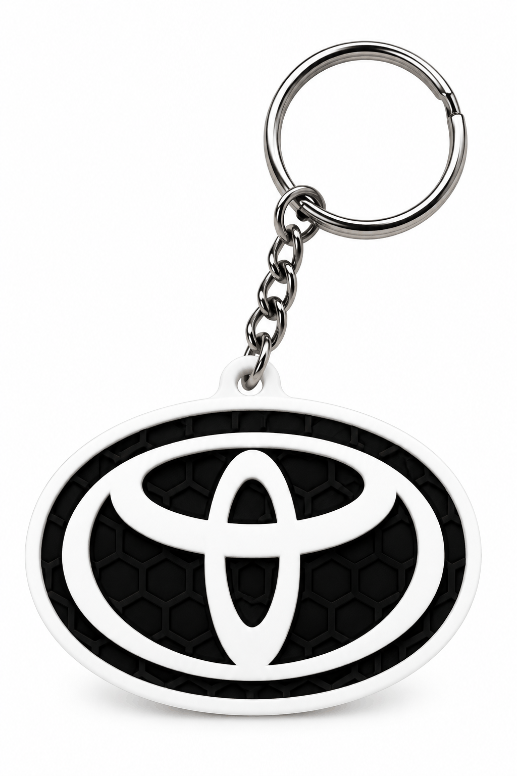 Privjesak za ključeve s crnim reljefnim uzorkom saća, bijelim ovalnim rubom i istaknutim Toyota logotipom